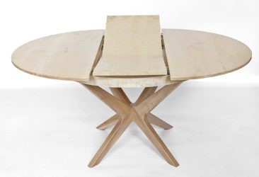 Extending dining table showing butterfly leaf extension