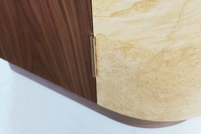 Hall Cabinet - detail of polished nickel hinge at base of curved door