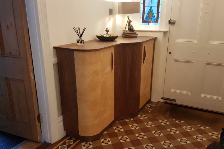 Photograph of curved cabinet installed in hallway