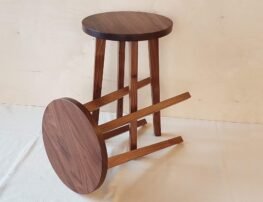 Two walnut side tables one on it's side and one standing up