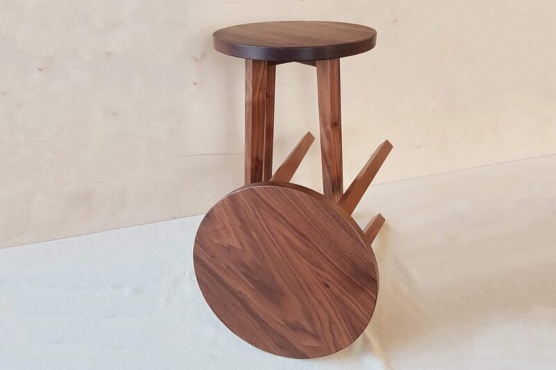 Two wooden side tables in walnut