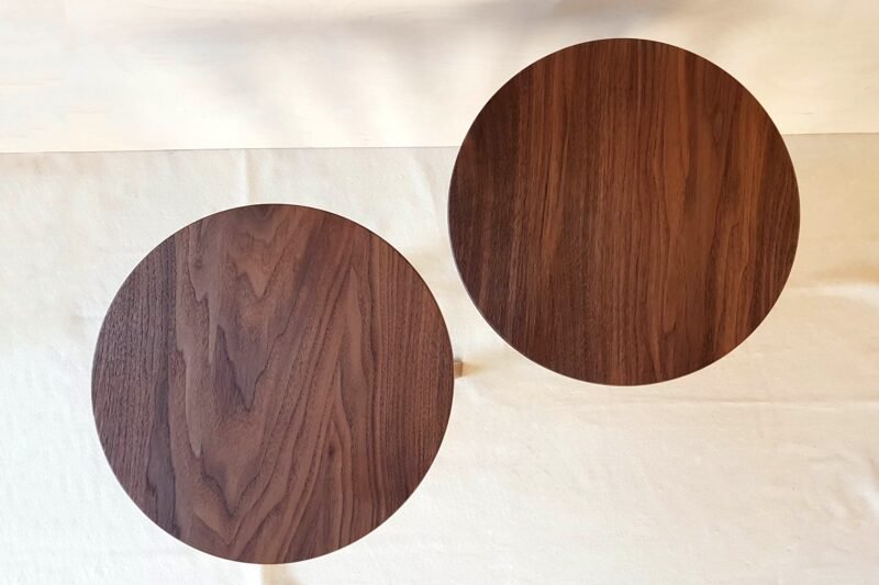 View on the tops of two walnut side tables